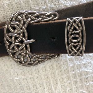Handcrafted Braided silver buckle and belt tip on a black leather belt